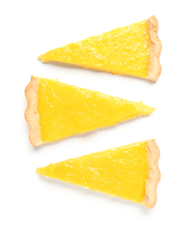 Pieces of tasty lemon pie on white backgroundの写真素材