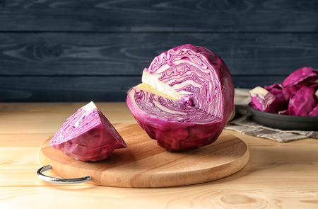 Cut red cabbage on wooden boardの写真素材