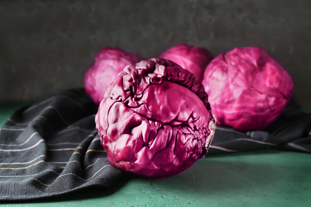 Fresh red cabbage on color tableの写真素材