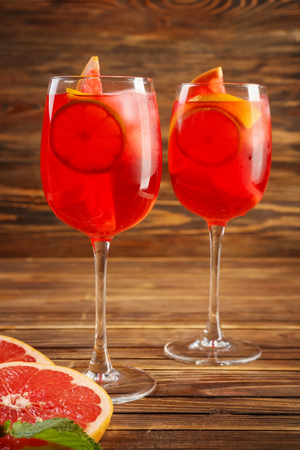 Fresh summer cocktail in glasses on wooden tableの写真素材