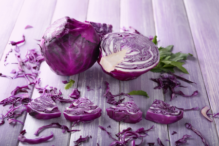 Sliced red cabbage on wooden tableの写真素材