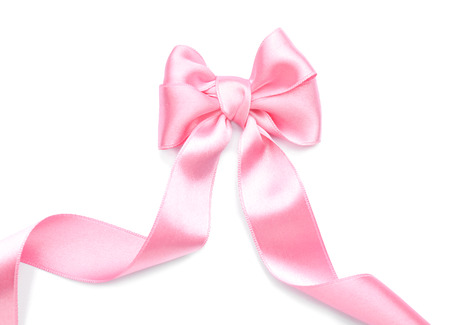 Beautiful bow made from pink ribbon on white backgroundの写真素材