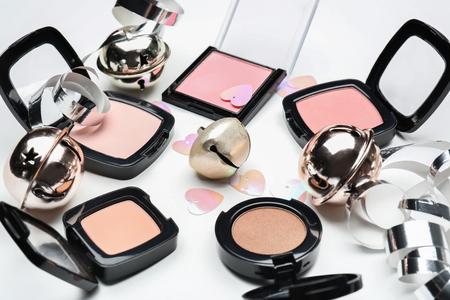 Set of cosmetics with Christmas decorations on white backgroundの写真素材
