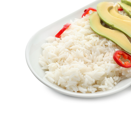 Plate with tasty boiled rice and vegetables on white background, closeupの写真素材