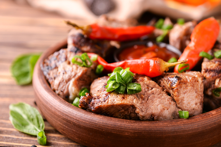Bowl with delicious shish kebab on wooden table, closeupの写真素材