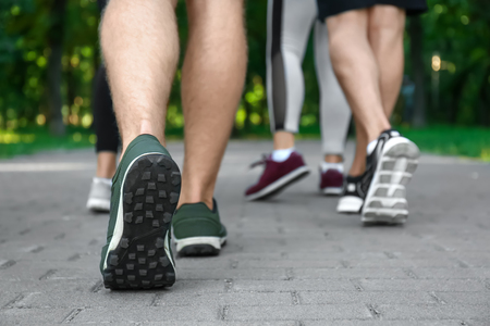 Young sporty people running outdoorsの写真素材