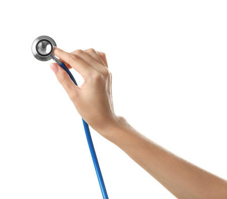 Female hand with medical stethoscope on white backgroundの写真素材