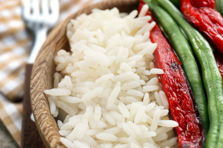 Tasty boiled rice with vegetables in bowl, closeupの写真素材
