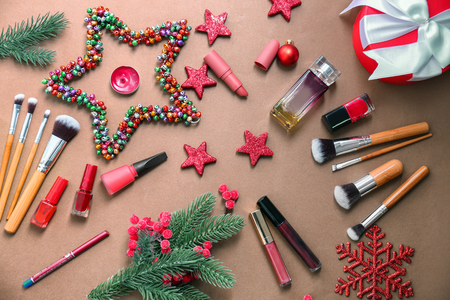 Set of cosmetics with Christmas decorations on color backgroundの写真素材