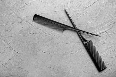 Professional hairdresser's hair combs on grey backgroundの写真素材
