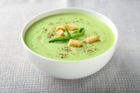 Bowl with delicious zucchini soup on napkin, closeupの写真素材
