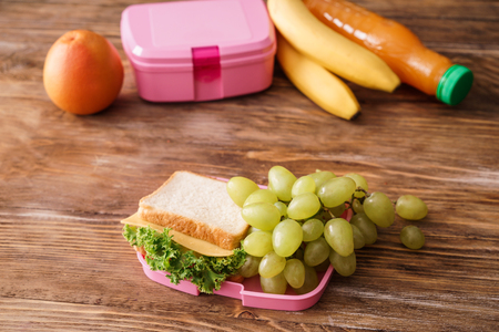 Appetizing food for schoolchild on wooden tableの写真素材