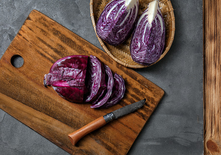 Composition with cut red cabbage on grunge tableの写真素材