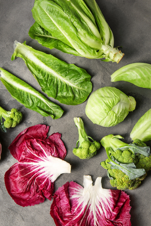 Different types of cabbage on grey backgroundの写真素材