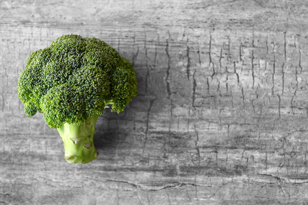 Fresh green broccoli on wooden tableの写真素材