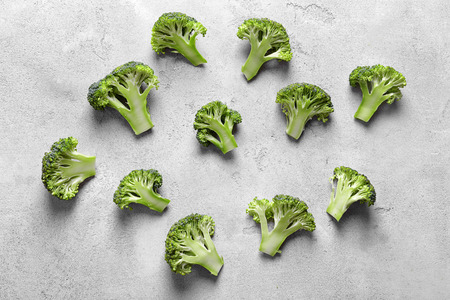 Fresh green broccoli on grey tableの写真素材