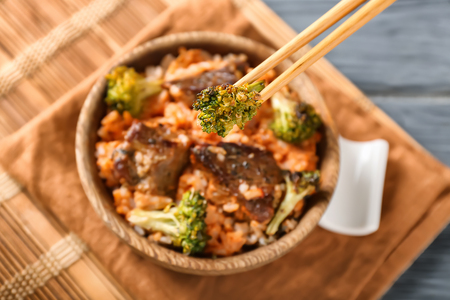 Eating of boiled rice with meat and broccoli, closeupの写真素材