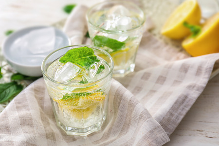 Glasses of fresh lemonade on tableの写真素材