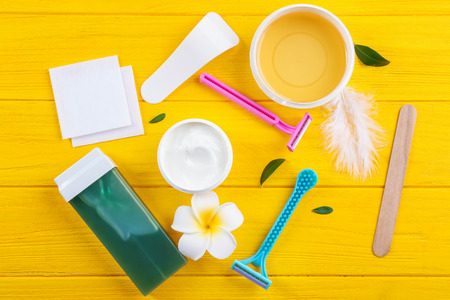 Set for hair removing on color wooden backgroundの写真素材