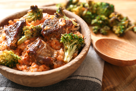 Bowl with boiled rice, meat and broccoli on board, closeupの写真素材