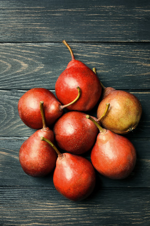 Ripe red pears on wooden tableの写真素材