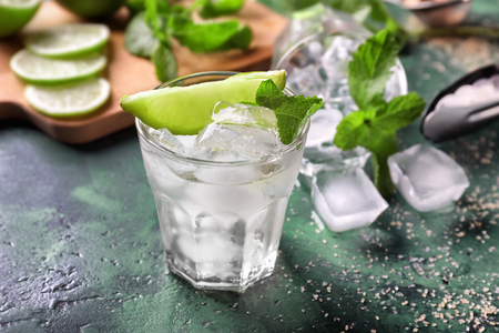 Glass of fresh mojito on tableの写真素材