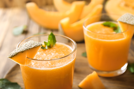 Glass of tasty melon smoothie, closeupの写真素材