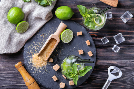 Composition with fresh mojito on wooden tableの写真素材
