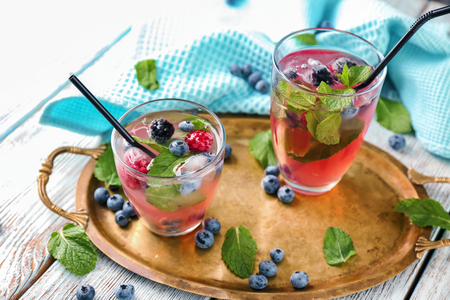 Glasses of refreshing summer cocktail on tableの写真素材