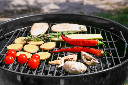 Tasty vegetables on barbecue grill outdoors, closeupの写真素材