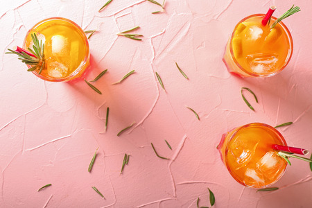 Fresh summer cocktail in glasses on color table