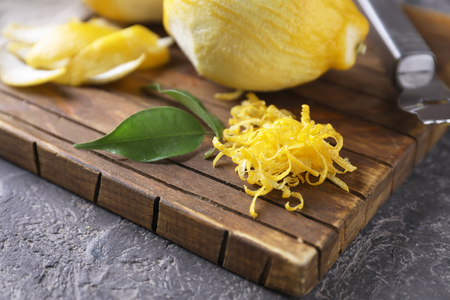 Fresh lemon zest on wooden boardの写真素材