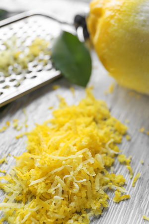 Fresh lemon zest on wooden backgroundの写真素材