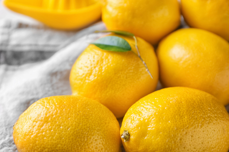 Ripe whole lemons on tableの写真素材