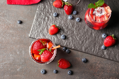 Fresh summer cocktails in glasses on grey tableの写真素材