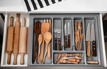 Set of clean kitchen utensils in drawerの写真素材