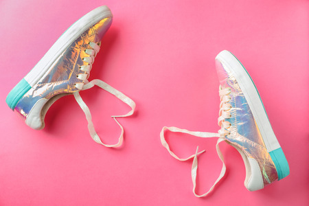 Shoes with heart shaped laces on color backgroundの写真素材