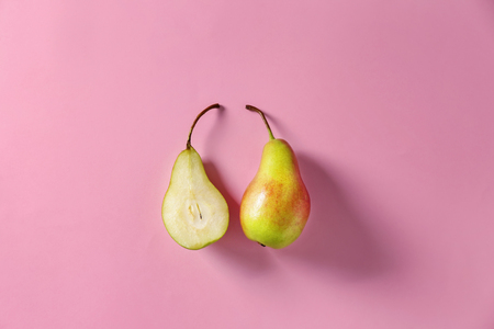 Ripe pears on color backgroundの写真素材