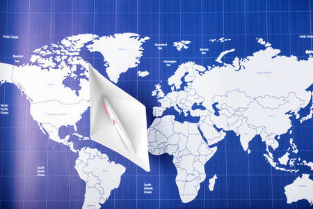 Origami boat on world map. Travel conceptの写真素材