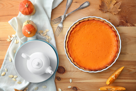 Composition with tasty pumpkin pie on wooden tableの写真素材