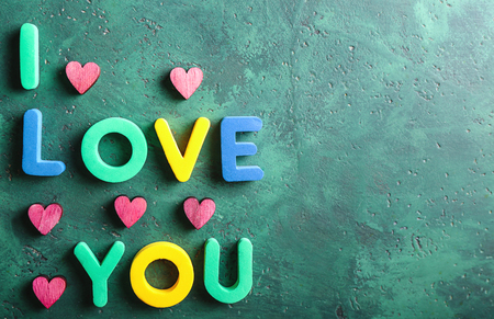 Phrase I LOVE YOU with hearts on color backgroundの写真素材