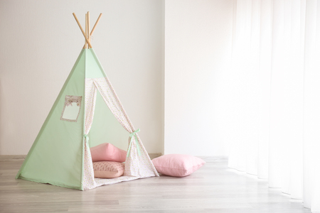 Cozy play tent for kids in roomの写真素材
