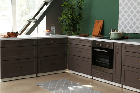 Interior of modern kitchen with stylish furniture