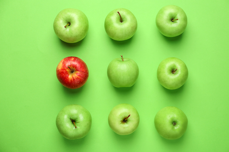 Ripe fresh apples on color backgroundの写真素材