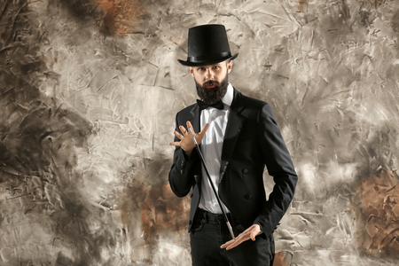 Male magician on grunge backgroundの写真素材