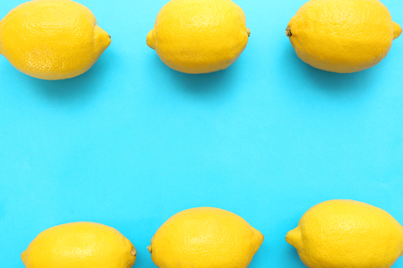 Fresh lemons on color background, flat layの写真素材