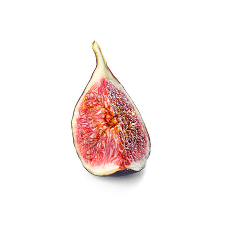 Piece of ripe purple fig on white background