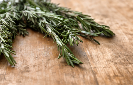 Fresh rosemary on wooden table, closeupの写真素材