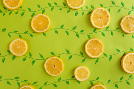 Flat lay composition with lemon slices on color backgroundの写真素材