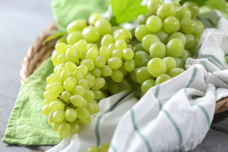 Ripe juicy grapes on table, closeupの写真素材